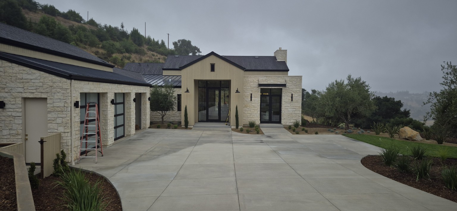 Completed custom hillside home served by Pro-Tech Plumbing